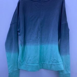 Grey and teal long sleeve tee.